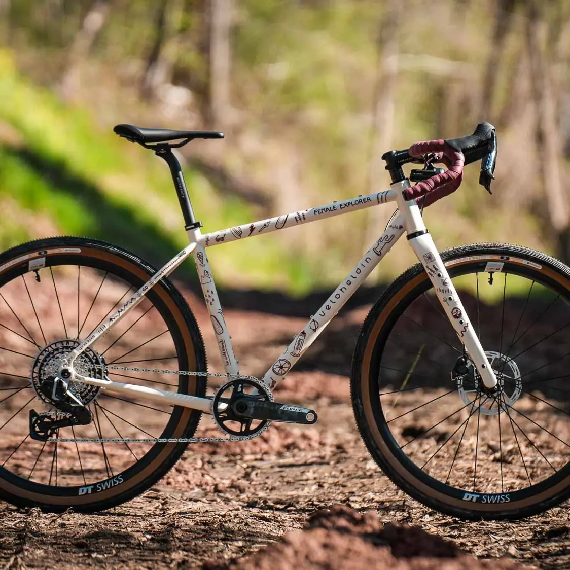 veloheld iconX Female Explorer gravel bike in the woods, custom bike for bikepacking